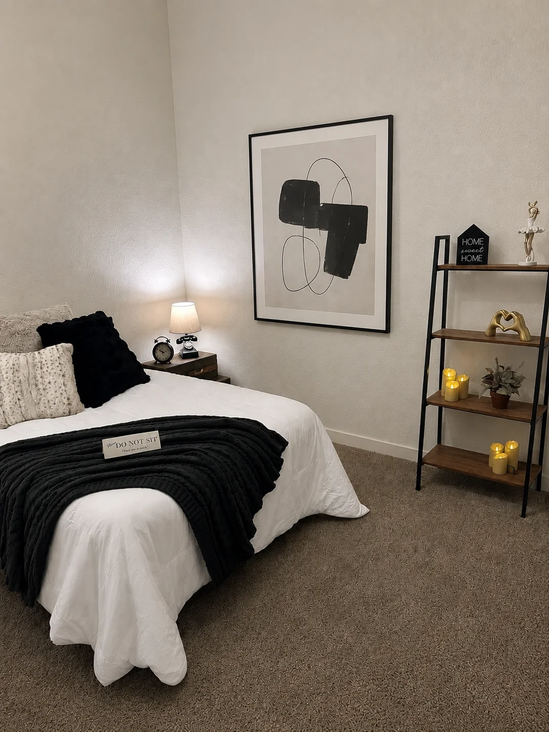 Staged black and white bedroom