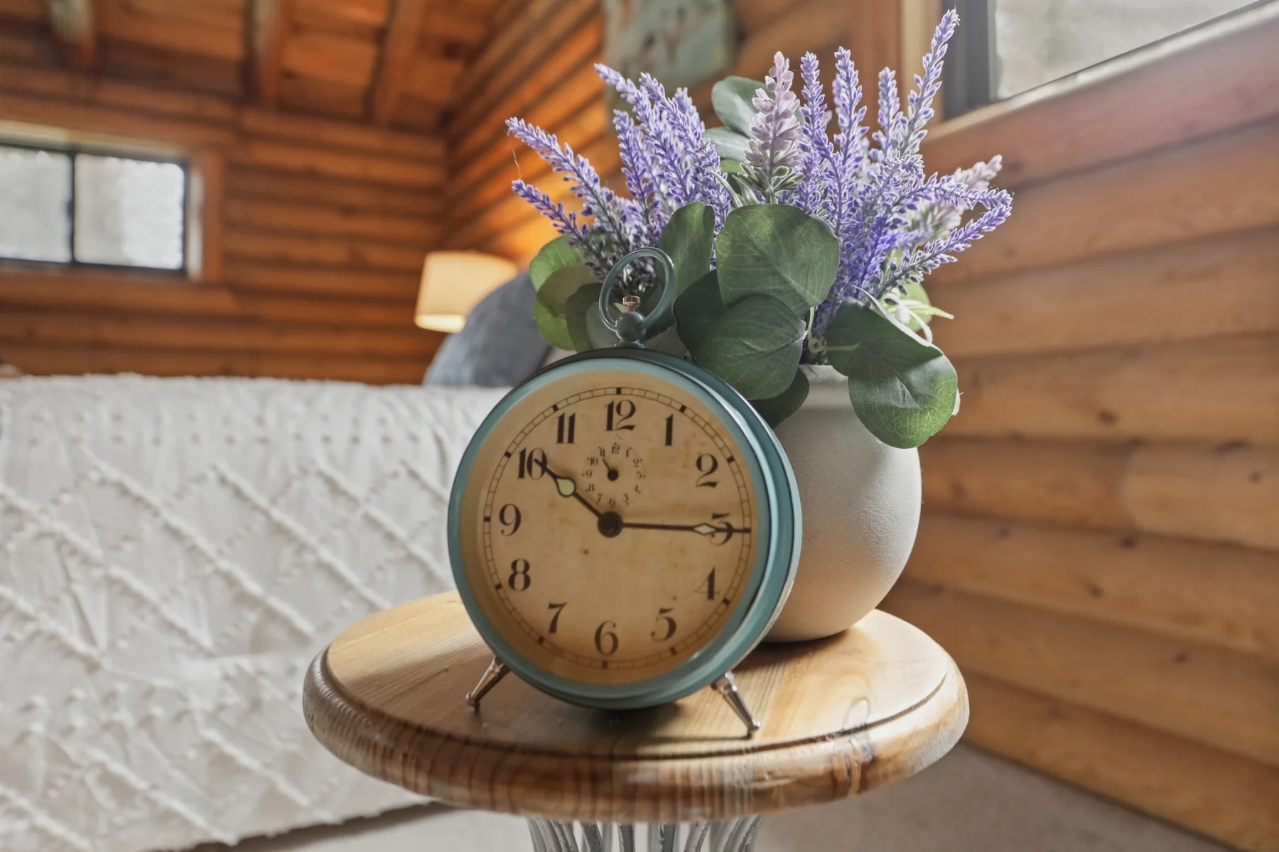 Staging detail with clock and flowers